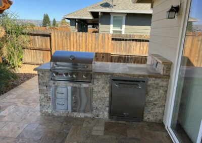 outdoor kitchen next to new swimming pool built by Emerald Pools